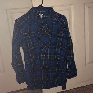 A plaid quarter button flannel .